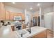 Functional kitchen featuring bright cabinets, tile backsplash, and modern appliances, great for meal preparation and storage at 3546 Broadlands Ln # 102, Broomfield, CO 80023