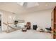 Bright open loft space featuring a skylight with chair and exercise equipment at 3546 Broadlands Ln # 102, Broomfield, CO 80023