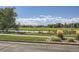 Scenic view of golf course and water features from the property and surrounding landscape at 3546 Broadlands Ln # 102, Broomfield, CO 80023