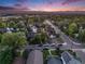 Daytime aerial view of the neighborhood showcasing mature trees and well-maintained streets and the sky at 1609 S Clayton St, Denver, CO 80210