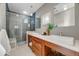 Modern bathroom featuring a double sink vanity, a glass-enclosed shower, and stylish tile accents at 1609 S Clayton St, Denver, CO 80210