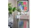 Close up of flowers, decor, and colorful artwork in the dining room at 1609 S Clayton St, Denver, CO 80210
