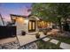 Inviting front porch with seating and plants, providing a charming entrance to the home. Address visible at 1609 S Clayton St, Denver, CO 80210