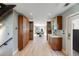 Hallway with beautiful wood floors and ample built-in storage cabinets, leading to a dining area at 1609 S Clayton St, Denver, CO 80210