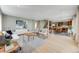 Bright, open-concept living room flows into the modern kitchen, creating a spacious and inviting living space at 1609 S Clayton St, Denver, CO 80210