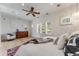 Main bedroom features natural light, dresser, and seating area at 1609 S Clayton St, Denver, CO 80210