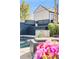 Outdoor pool with stone waterfall feature, landscaping, and lounge seating at daytime at 1609 S Clayton St, Denver, CO 80210
