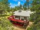 Aerial view of a home with a spacious deck, perfect for entertaining and enjoying the surrounding nature at 997 Dogwood Dr, Golden, CO 80401