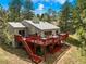 Exterior photo showcasing a multilevel deck with dining and relaxing spaces, ideal for outdoor living at 997 Dogwood Dr, Golden, CO 80401