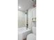 Bathtub and shower combination with decorative tiling and updated fixtures at 997 Dogwood Dr, Golden, CO 80401