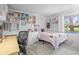 Bedroom featuring a built-in bookcase, desk area, and comfortable sleeping space at 997 Dogwood Dr, Golden, CO 80401