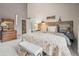 Bedroom featuring a unique headboard design and ensuite bathroom access at 997 Dogwood Dr, Golden, CO 80401