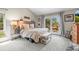 Bright bedroom with vaulted ceilings and a sliding glass door leading to a private balcony at 997 Dogwood Dr, Golden, CO 80401