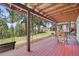 Covered deck with a swing and foosball table, perfect for outdoor fun and relaxation at 997 Dogwood Dr, Golden, CO 80401