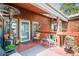 Inviting outdoor patio area with comfortable seating, wood railings and space heater for cozy evenings at 997 Dogwood Dr, Golden, CO 80401