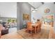 Elegant dining room with hardwood floors and stylish decor, open to the living room and kitchen at 997 Dogwood Dr, Golden, CO 80401