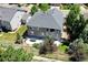 Aerial view of a house with a large backyard and patio at 7329 Arco Iris Ln, Castle Pines, CO 80108