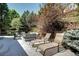 Spacious patio area with lounge chairs and outdoor seating at 7329 Arco Iris Ln, Castle Pines, CO 80108