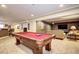 Finished basement featuring a pool table, wet bar, and lounge area for a variety of entertainment options at 7329 Arco Iris Ln, Castle Pines, CO 80108