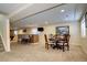 Finished basement with wet bar, dining area, and rec space provides ample room for entertaining and relaxation at 7329 Arco Iris Ln, Castle Pines, CO 80108