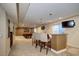 Inviting finished basement features a wet bar, game area, and comfortable seating for entertainment and relaxation at 7329 Arco Iris Ln, Castle Pines, CO 80108