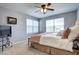 Bright bedroom featuring plush carpet, ceiling fan, and soft pastel accents, enhancing this calming atmosphere at 7329 Arco Iris Ln, Castle Pines, CO 80108