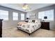 Cozy bedroom features carpeted floors, ceiling fan, and modern furnishings, creating a relaxing atmosphere at 7329 Arco Iris Ln, Castle Pines, CO 80108