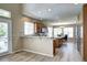 Spacious kitchen with an island, stainless steel appliances, and wood flooring at 7329 Arco Iris Ln, Castle Pines, CO 80108