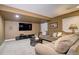 Comfortable living room with plush sofas, mounted TV, and neutral tones, a relaxing space for leisure at 7329 Arco Iris Ln, Castle Pines, CO 80108