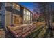 Home's backyard with patio and landscaping at dusk at 11729 Elmer Linn Dr, Longmont, CO 80504