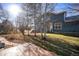Landscaped backyard with mature trees and walkway at 11729 Elmer Linn Dr, Longmont, CO 80504