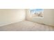Bright bedroom with neutral carpeting and a window at 11729 Elmer Linn Dr, Longmont, CO 80504