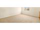 Spacious bedroom with neutral carpeting and a window at 11729 Elmer Linn Dr, Longmont, CO 80504