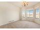 Well-lit dining room with bay window and neutral colored walls at 11729 Elmer Linn Dr, Longmont, CO 80504