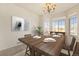 Bright dining room featuring a large window and wood table at 11729 Elmer Linn Dr, Longmont, CO 80504