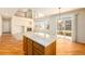 Kitchen with light wood cabinets, stainless steel appliances, and an island at 11729 Elmer Linn Dr, Longmont, CO 80504
