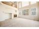 Living room with high ceilings, hardwood floors, and a fireplace at 11729 Elmer Linn Dr, Longmont, CO 80504