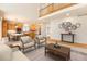 Spacious living room with high ceilings, hardwood floors, and a fireplace at 11729 Elmer Linn Dr, Longmont, CO 80504