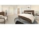 Main bedroom with carpeted floor and ensuite bathroom at 11729 Elmer Linn Dr, Longmont, CO 80504