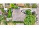 Aerial view of a single-Gathering home displaying the backyard patio, landscaping, and driveway at 8250 W 63Rd Ave, Arvada, CO 80004