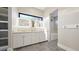 Bathroom with a double vanity, tile floors, and modern fixtures at 8250 W 63Rd Ave, Arvada, CO 80004