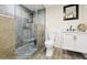 Beautiful bathroom with glass enclosed shower with custom tile and modern fixtures at 8250 W 63Rd Ave, Arvada, CO 80004