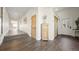 Inviting hallway featuring wood-look tile flooring and access to the rest of the home at 8250 W 63Rd Ave, Arvada, CO 80004