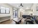 Relaxing living room with leather sofa, decorative coffee table, office desk and patio access at 8250 W 63Rd Ave, Arvada, CO 80004