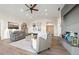 Bright living room with wood floors, ceiling fan and stylish decor at 8250 W 63Rd Ave, Arvada, CO 80004