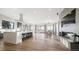 Expansive living space with open layout to the kitchen, a fireplace, and lots of natural light at 8250 W 63Rd Ave, Arvada, CO 80004
