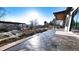 Expansive patio area with a built-in dining space, offering picturesque views and outdoor relaxation at 8250 W 63Rd Ave, Arvada, CO 80004