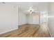 Spacious bedroom with wood-look floors, a ceiling fan, and natural light at 9462 Yampa Ct, Commerce City, CO 80022