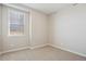 Cozy bedroom with plush carpeting, a large window, and neutral paint at 9462 Yampa Ct, Commerce City, CO 80022