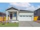 Charming single-Gathering home with a two-car garage and a welcoming front porch at 9462 Yampa Ct, Commerce City, CO 80022